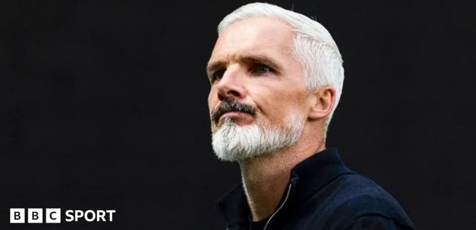 Man with white hair and beard in profile