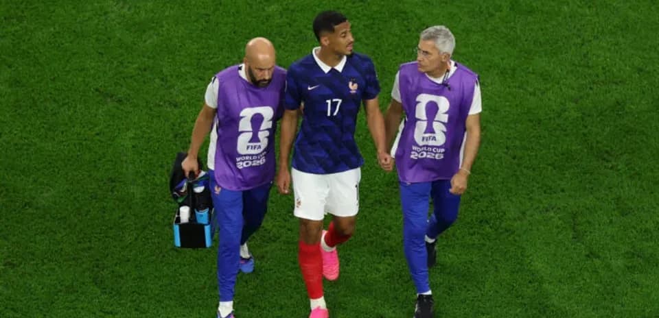 Player leaving field with medical staff during match