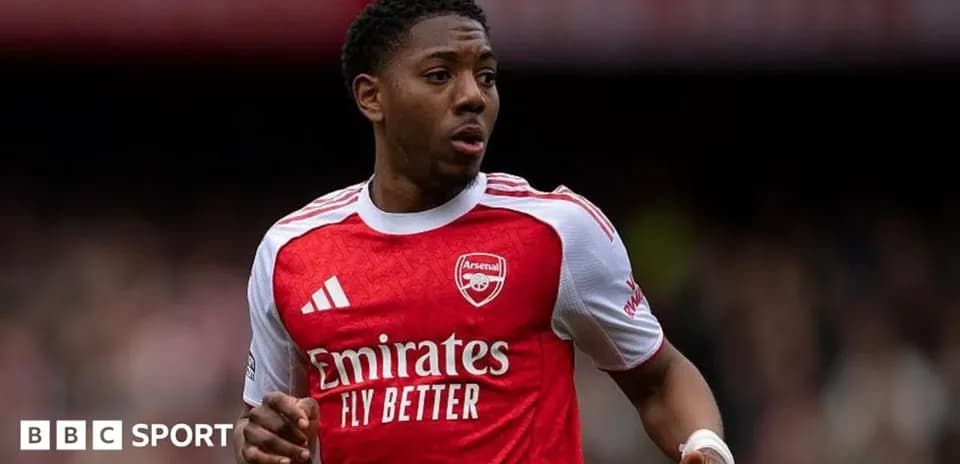 Player wearing Arsenal jersey during match action