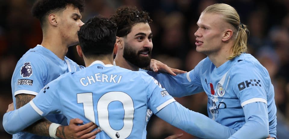 Manchester City players celebrating a goal