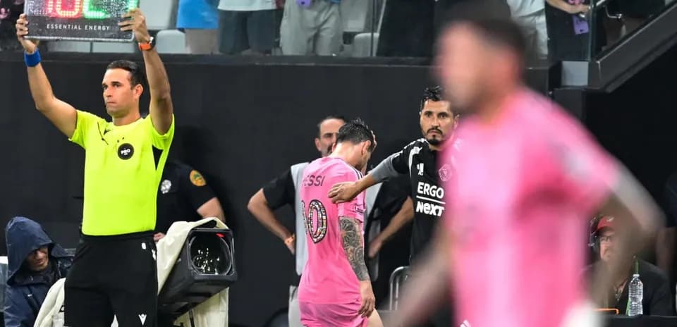 Substitution in progress with Messi leaving the field