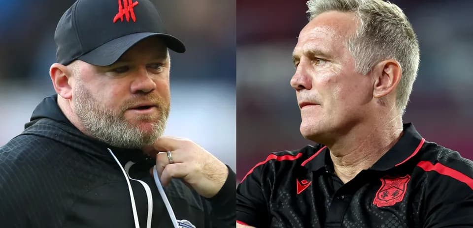 Two football managers during a match discussion