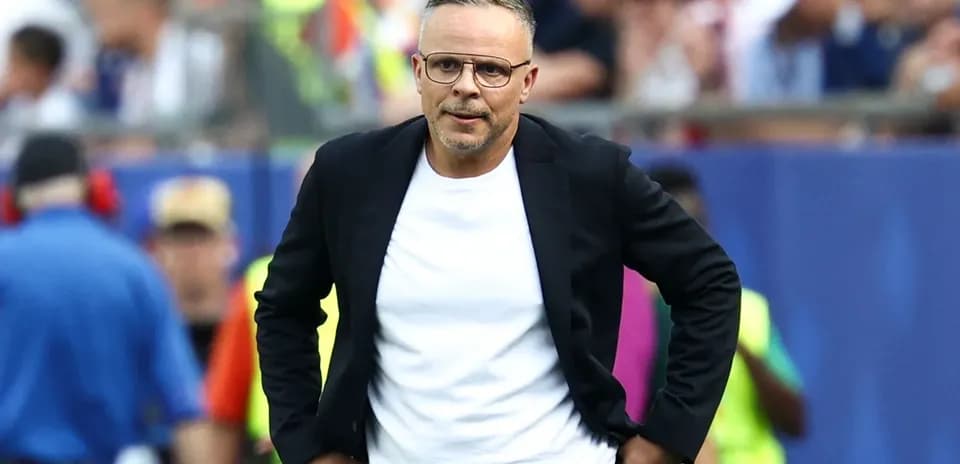 Coach walking on the sidelines during a match