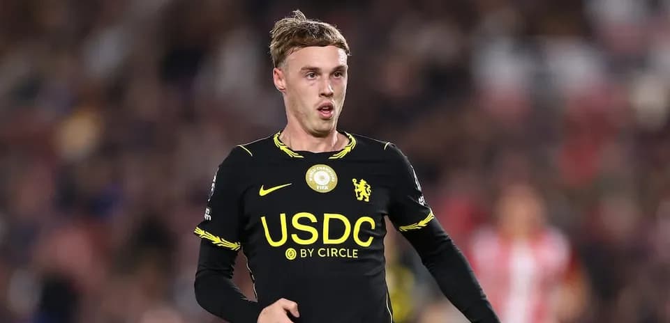Player in black kit during football match