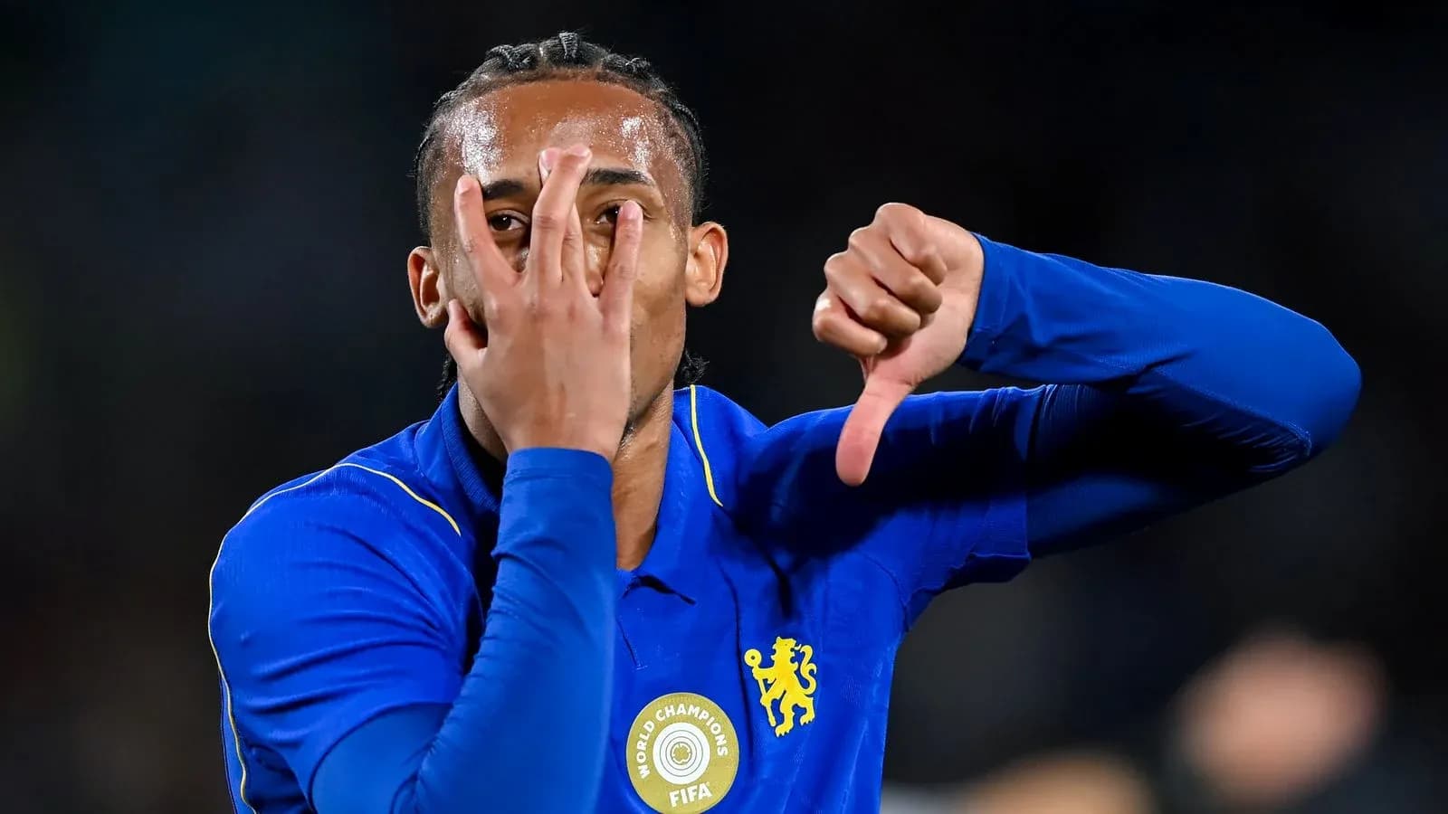 Player celebrating with hand gestures after match