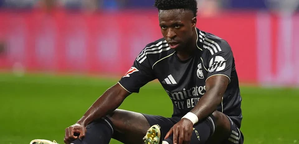 Player sitting on pitch after falling during match