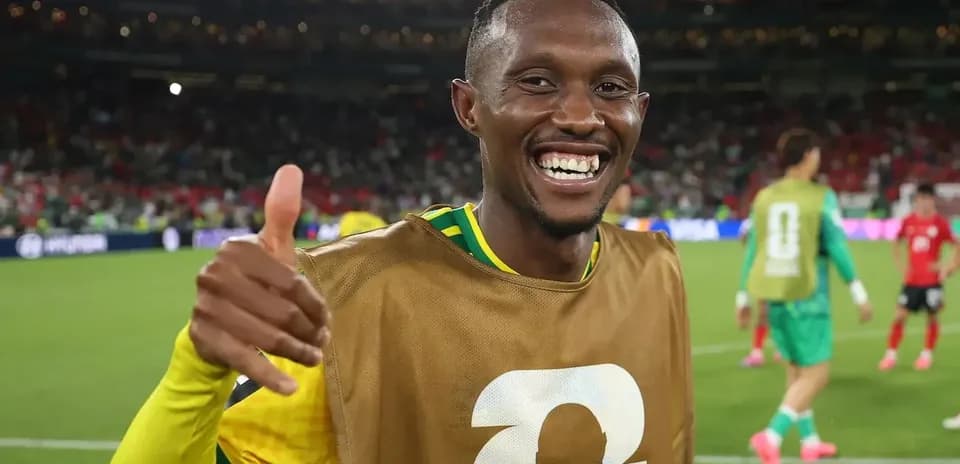 Player celebrating with thumbs up on field