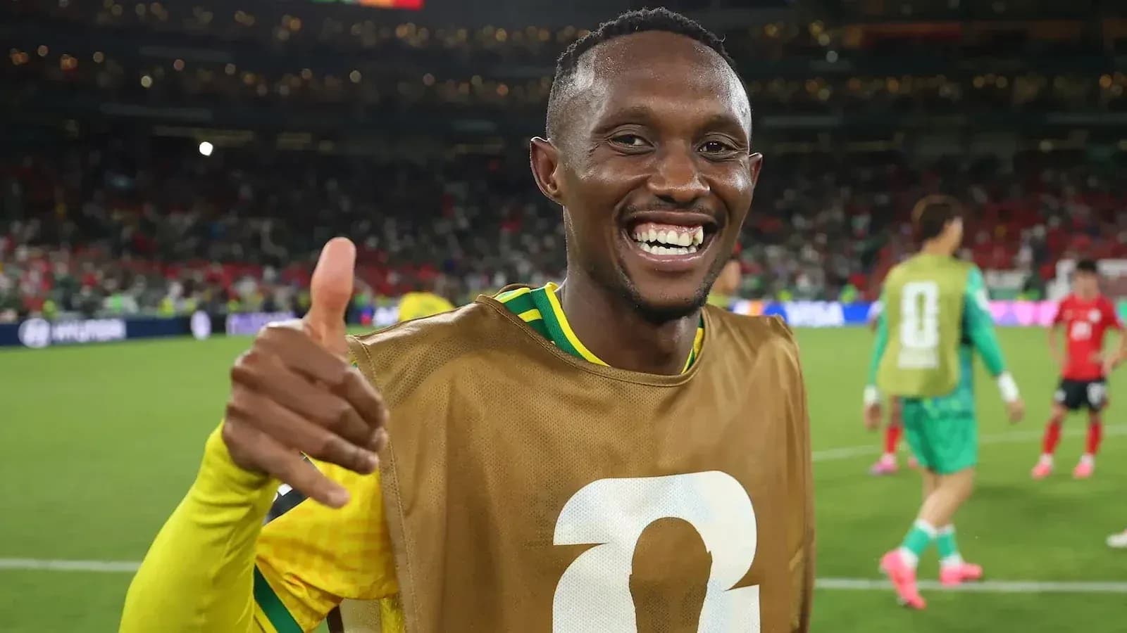 Player celebrating with thumbs up on field