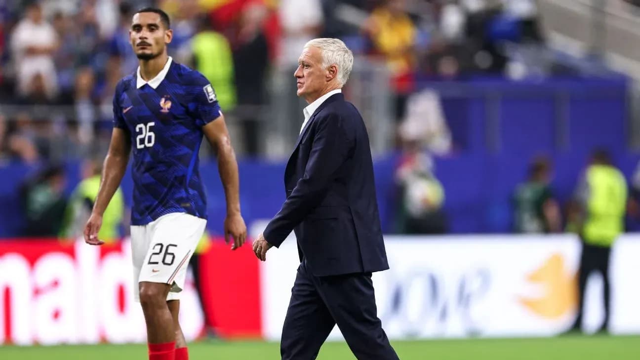 France coach walking past player on the field