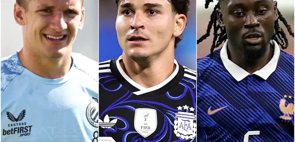 Three football players in team jerseys looking forward