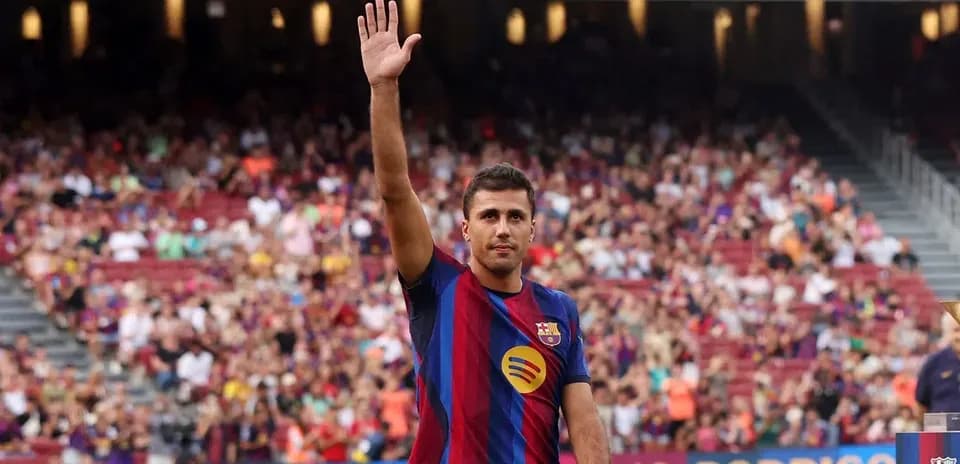 Player waving to fans during presentation at stadium