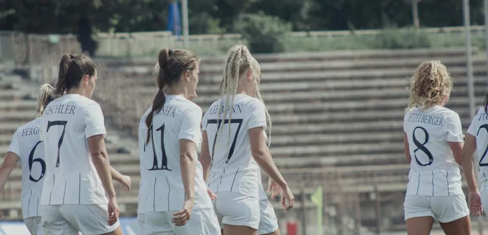 Women players walking on the field