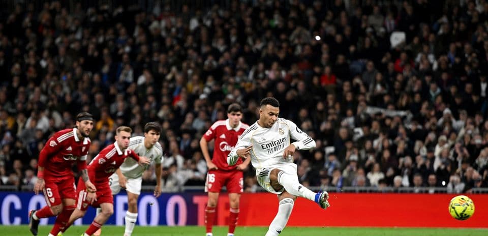 Real Madrid player taking a penalty kick
