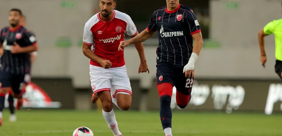Crvena Zvezda player dribbling past opponent