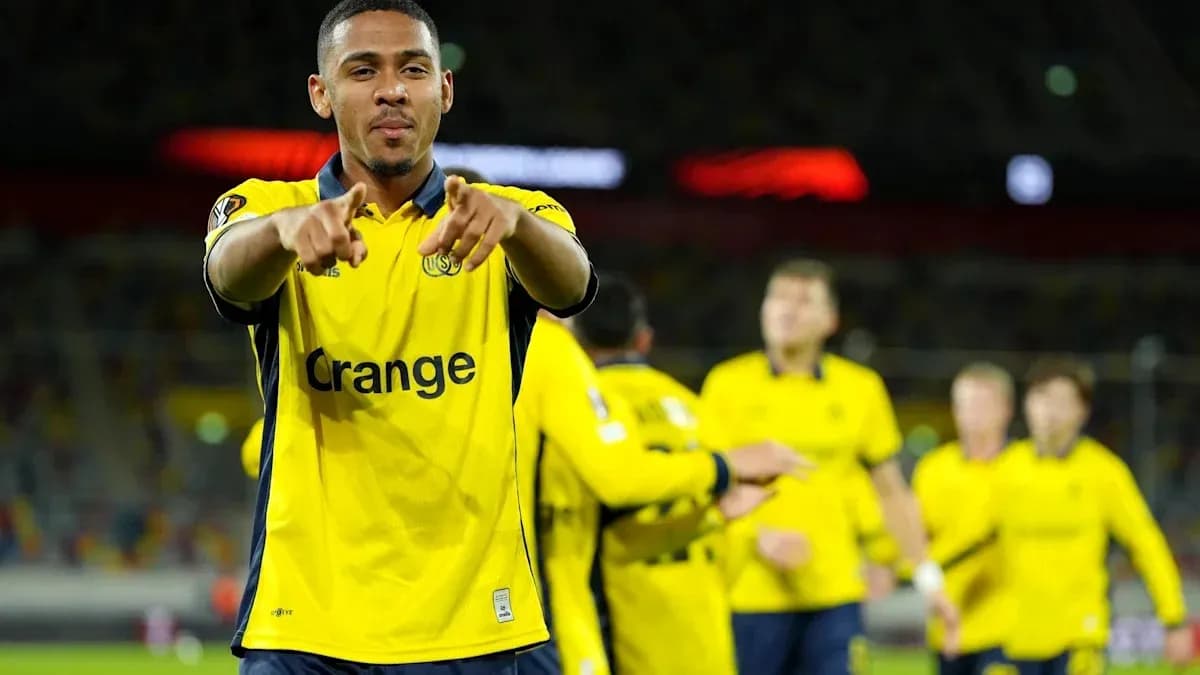 Player celebrating with teammates in yellow jerseys
