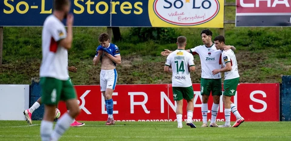 Players celebrating a goal during a match