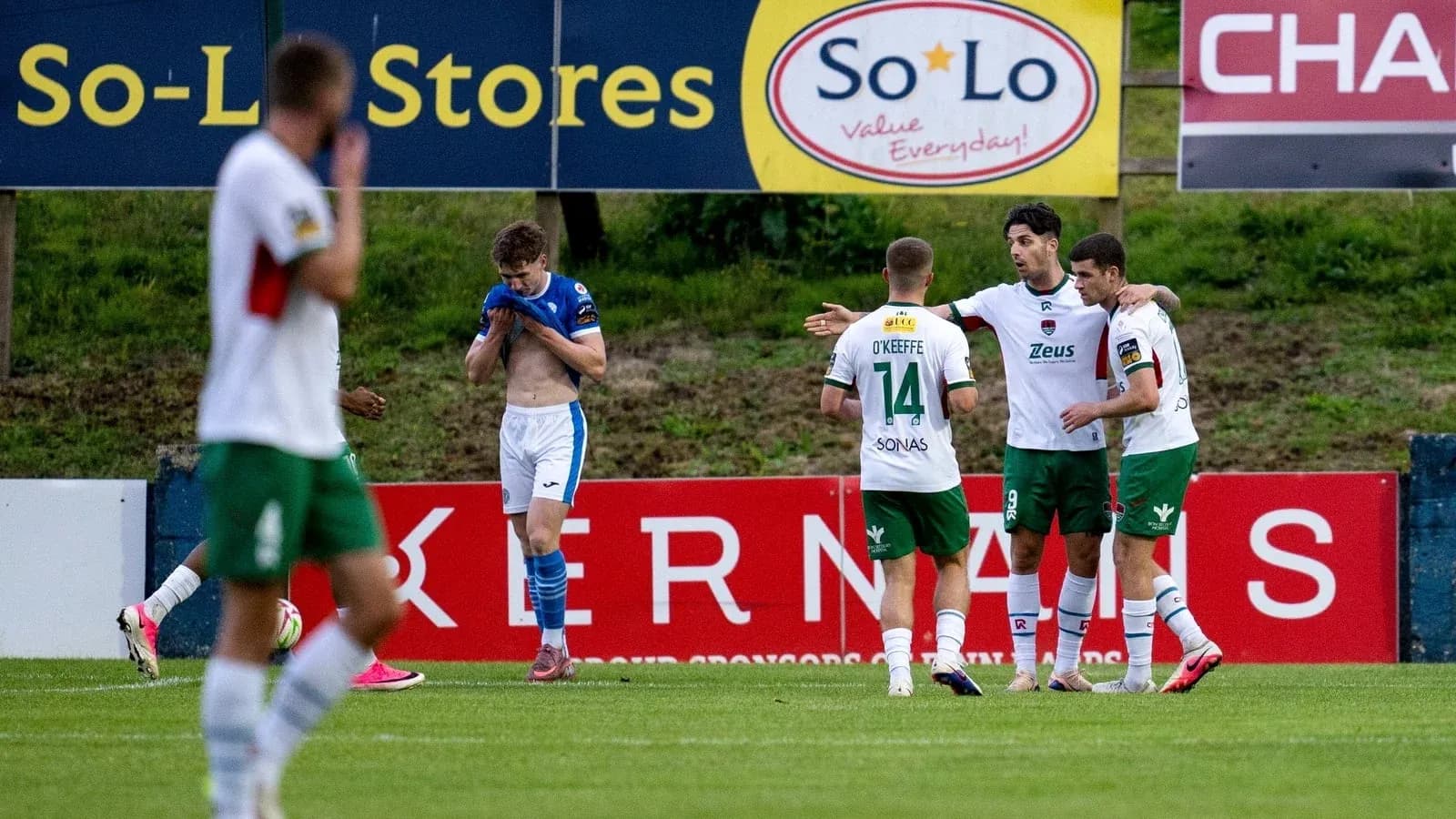 Players celebrating a goal during a match