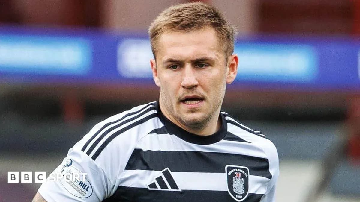 Player in black and white jersey during match