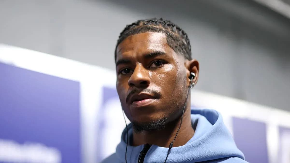 Athlete wearing earbuds in a casual setting