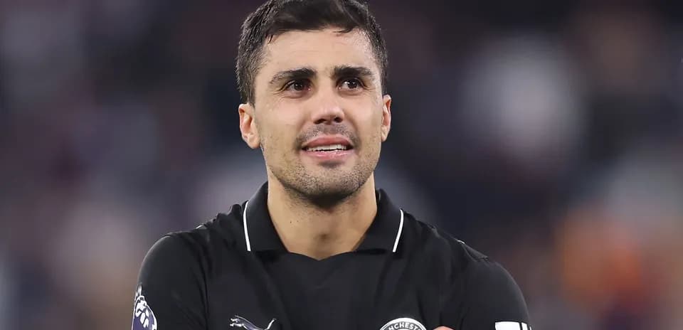 Player in black jersey during post-match celebration