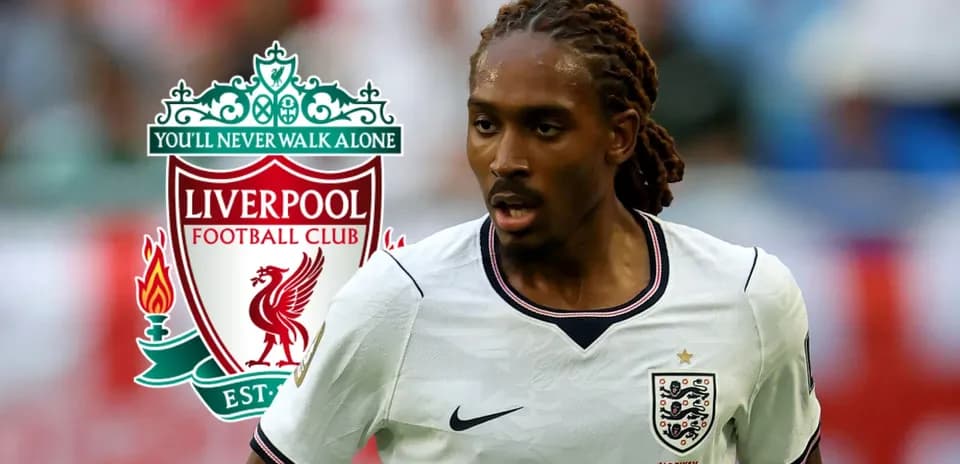 Player running with ball, Liverpool logo in background