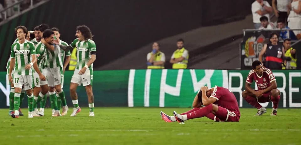 Players celebrating and others distressed after match