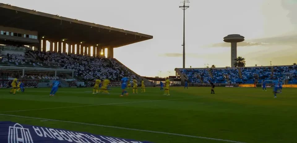 Players in blue and yellow competing on the field