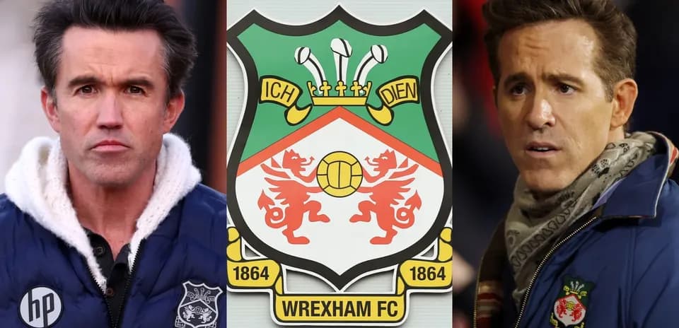 Two men beside Wrexham FC club crest