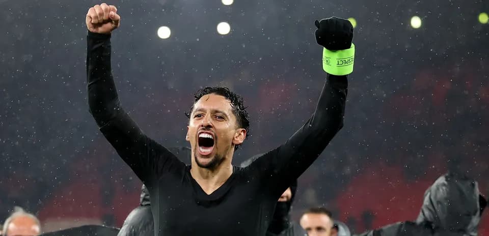 Player celebrating victory in the rain