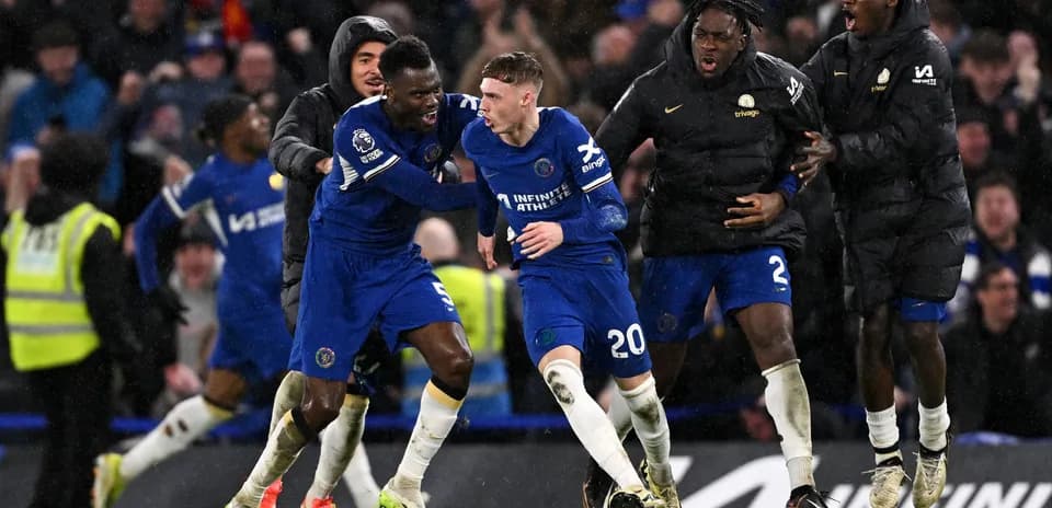 Chelsea players celebrating a goal during a match