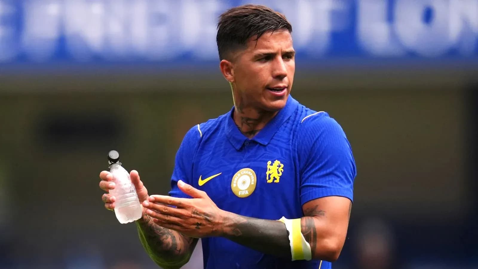 Player holding a water bottle during training session