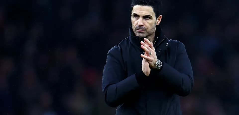 Manager clapping during match at stadium