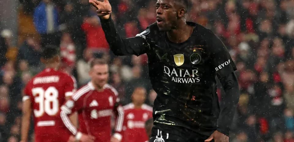 Player celebrating during match in rainy conditions