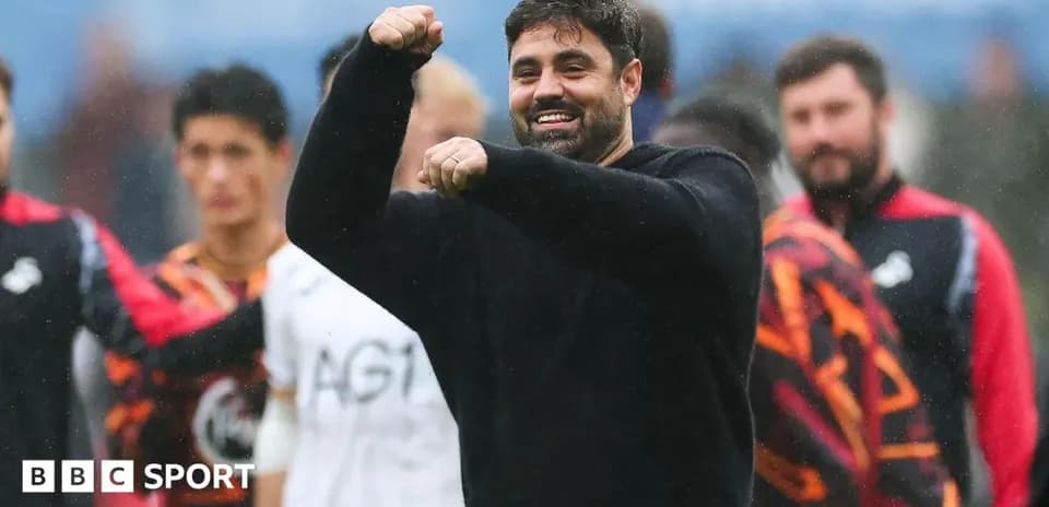 Coach celebrating with players after match victory