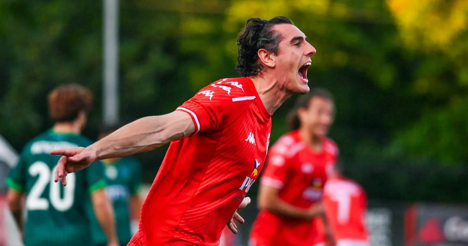 Player celebrating during Larne vs Saburtalo match