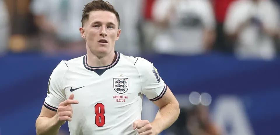 Player wearing England jersey running on the pitch