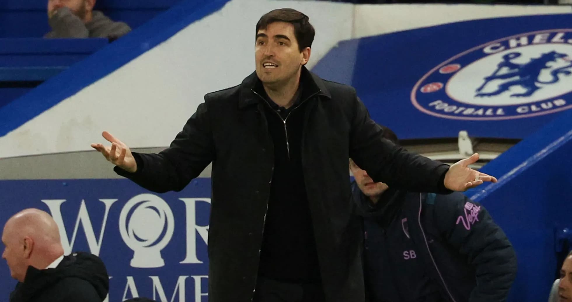 Manager gesturing on the sidelines during match