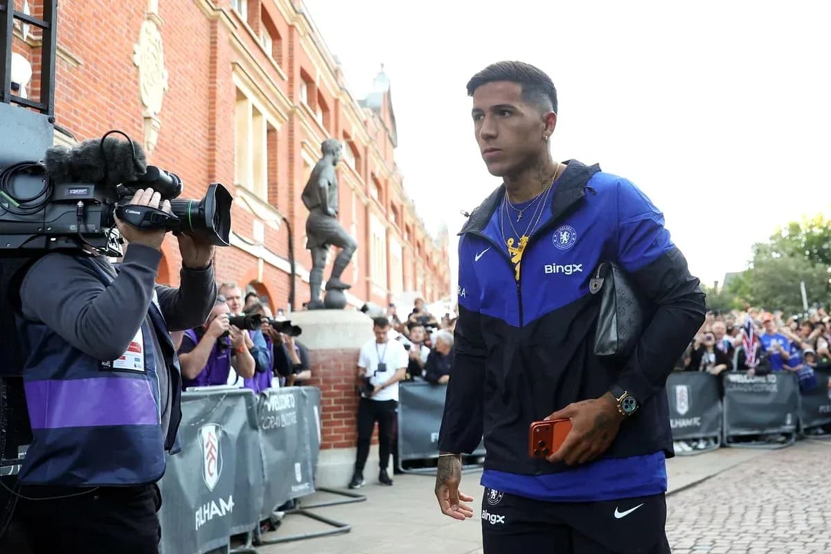 Player walking past cameras outside stadium