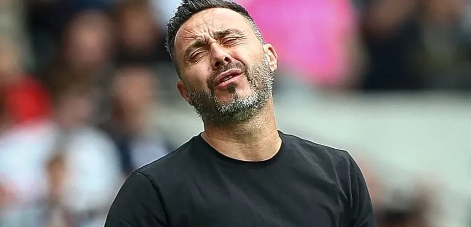 Coach reacting during a match on the sideline