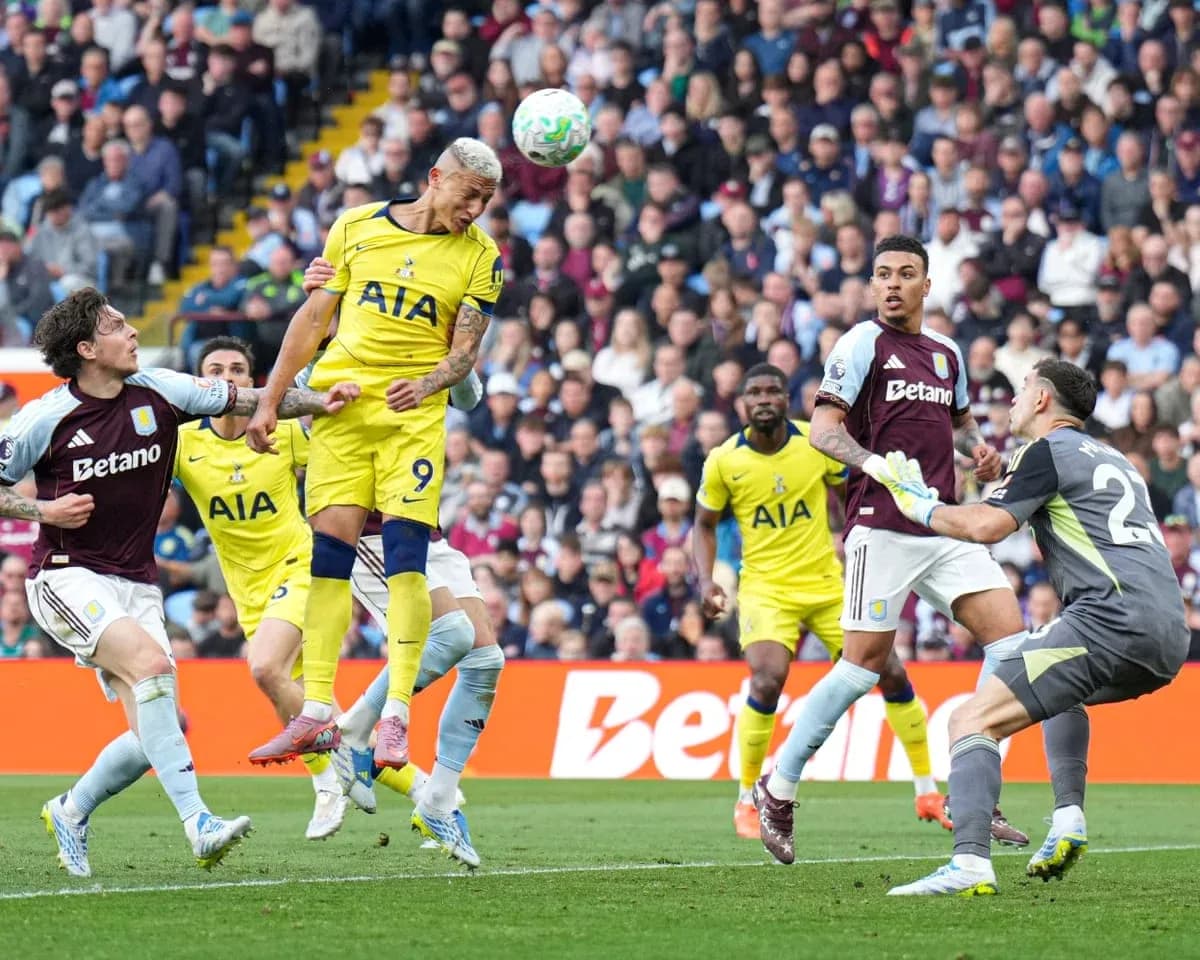 Richarlison heading the ball during match