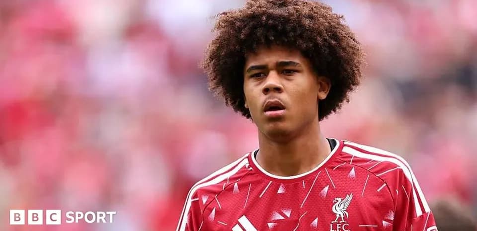 Player wearing Liverpool jersey during match warm-up