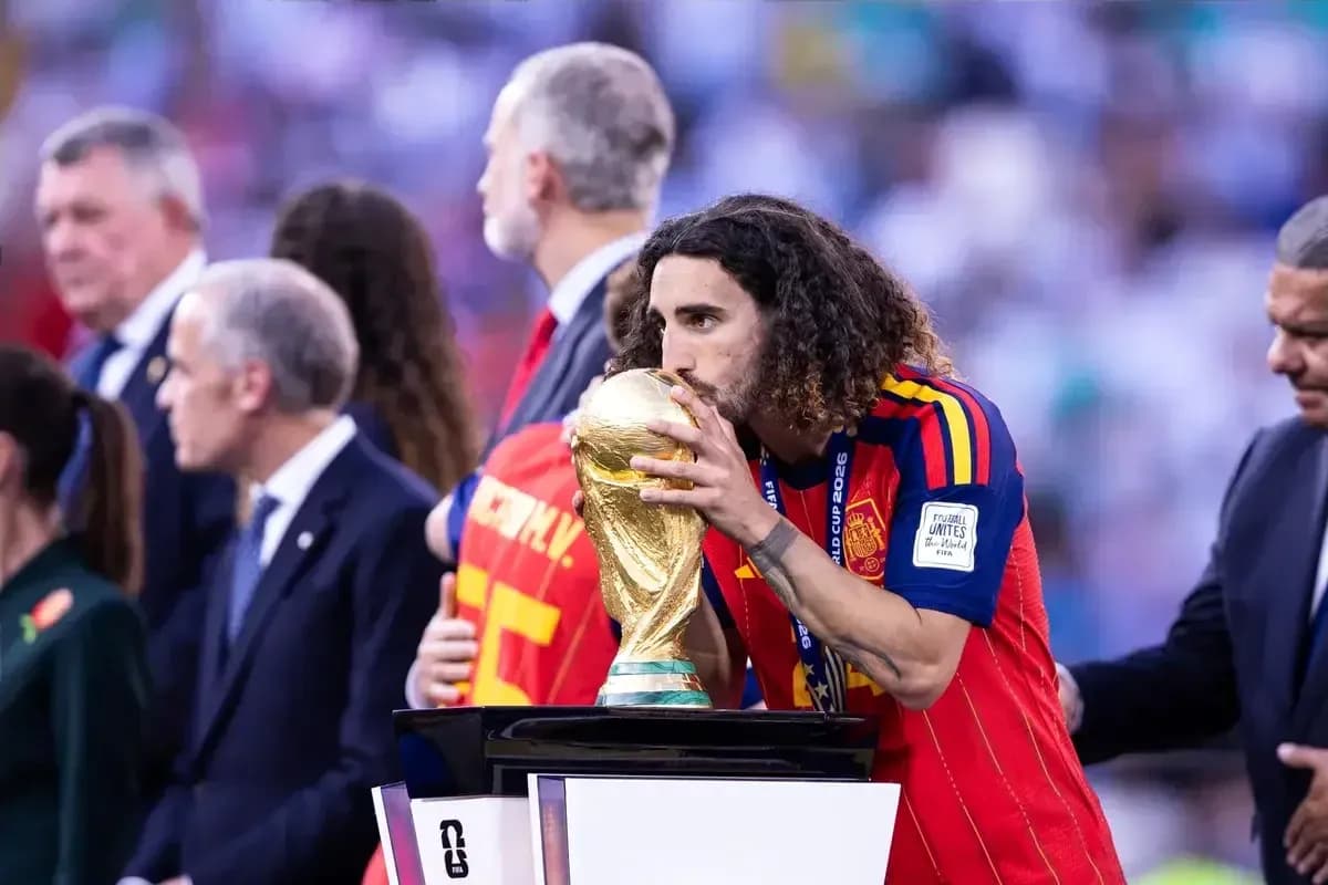 Player kissing World Cup trophy on podium