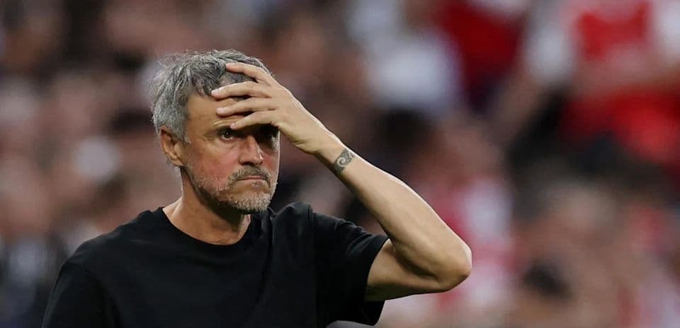 Coach reacting during a tense moment on the field