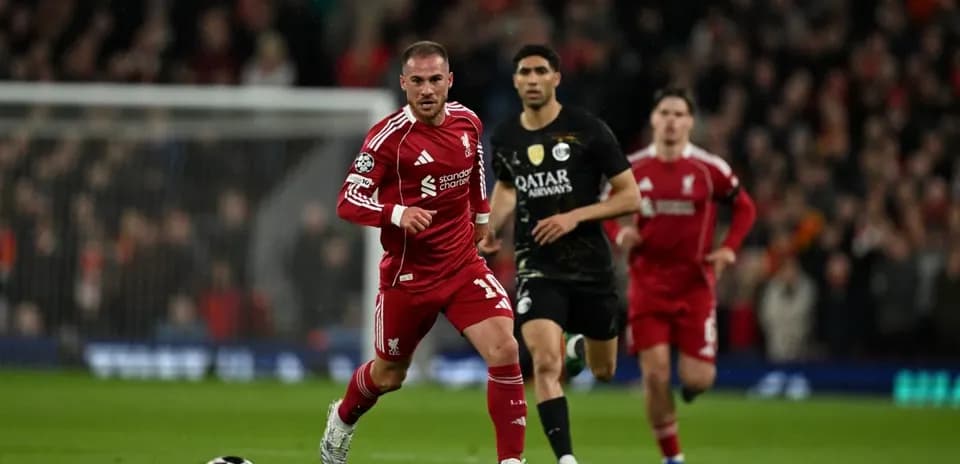 Liverpool player sprinting during a Champions League match