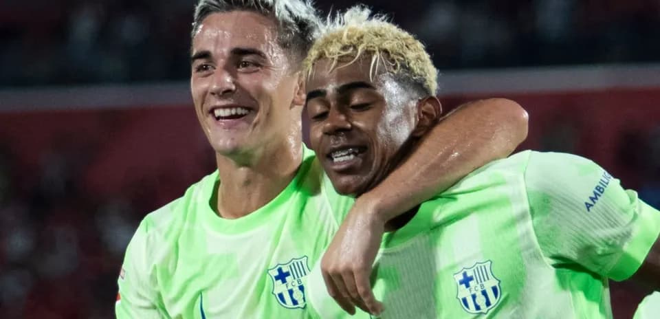 Two players celebrating in neon green jerseys