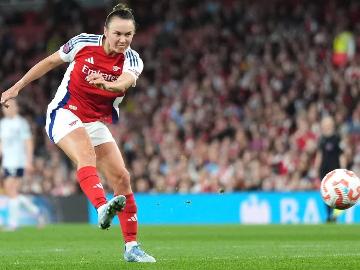 Arsenal player taking a shot on goal