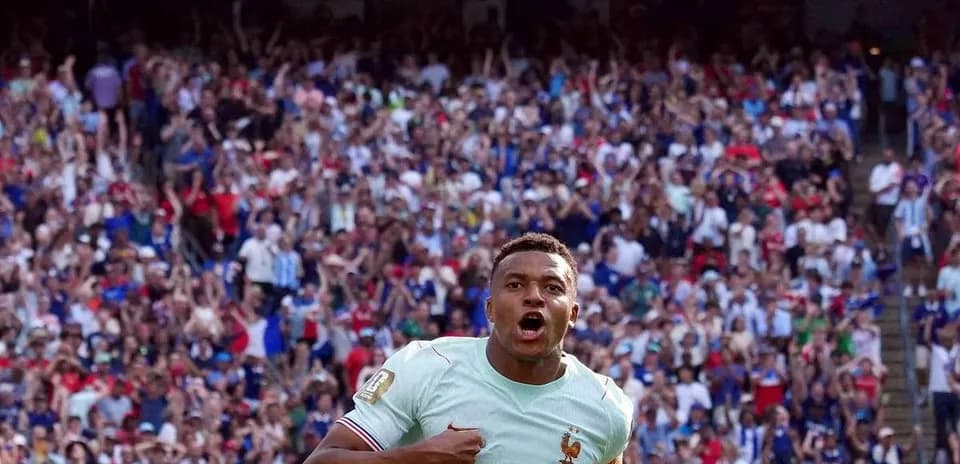 Player celebrating in front of cheering crowd