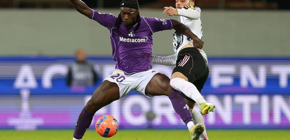 Player challenging for the ball during match