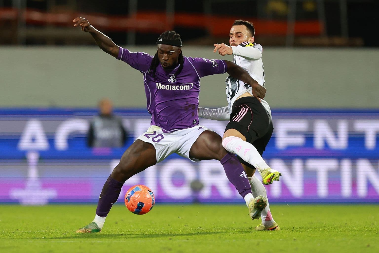 Player challenging for the ball during match