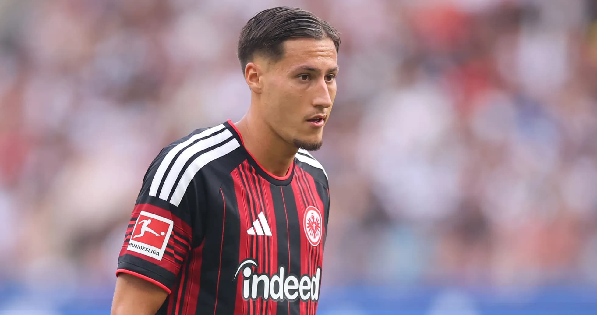 Player in Eintracht Frankfurt jersey on the field
